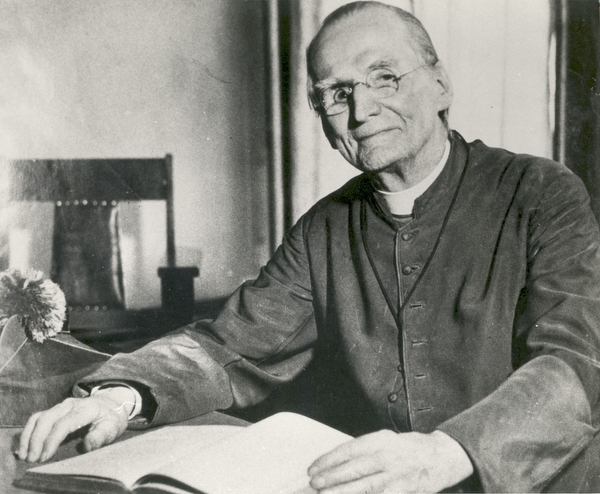 Father Baker at his desk.